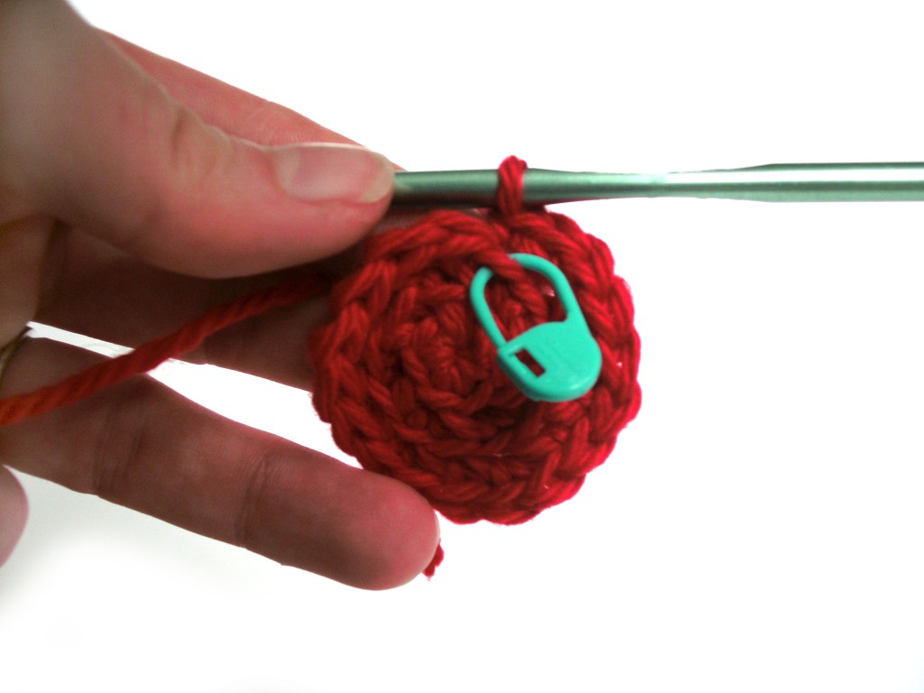 Using a stitch market to show where a crochet round ends.