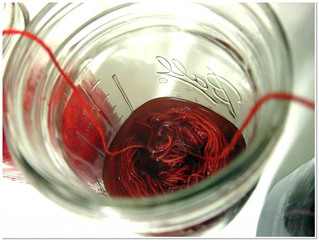 detail of yarn being dyed red