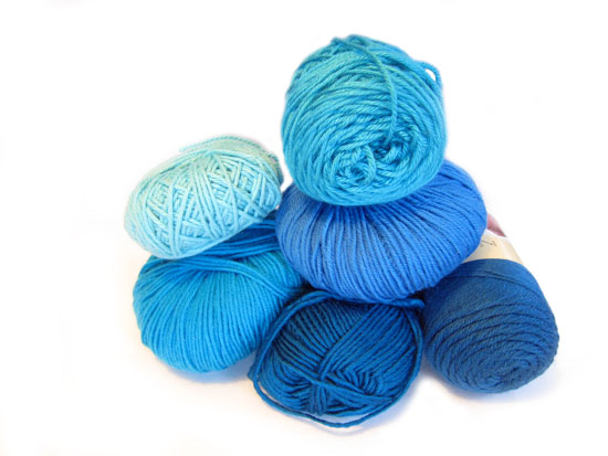 pile of blue yarns