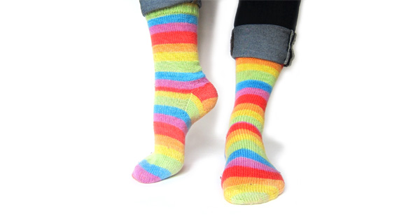 Rainbow striped socks knit by FreshStitches